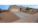 Charming single-story home with a stucco exterior and a two-car garage at 3818 N 306Th Ave, Buckeye, AZ 85396