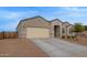Beautiful single-story home boasts a large driveway and low maintenance desert landscaping at 3818 N 306Th Ave, Buckeye, AZ 85396