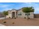 Charming single-story home featuring well-manicured desert landscape and a two-car garage at 3818 N 306Th Ave, Buckeye, AZ 85396