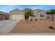 Attractive single-story home with a well-maintained front yard and desert landscaping at 3818 N 306Th Ave, Buckeye, AZ 85396