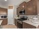 Well-equipped kitchen featuring stainless steel appliances, gas range, and ample counter space for cooking at 3818 N 306Th Ave, Buckeye, AZ 85396