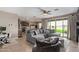 Comfortable living room that flows into an open kitchen with sliding glass door to the back patio at 3818 N 306Th Ave, Buckeye, AZ 85396
