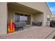 Covered patio with outdoor seating, a sliding glass door, and a view of the backyard at 3818 N 306Th Ave, Buckeye, AZ 85396