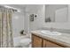 Well-lit bathroom featuring a shower-tub combination, single sink, and cabinet at 40511 N Birdie St, San Tan Valley, AZ 85140