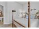 Comfortable bedroom featuring a decorative four poster bed and neutral décor at 40511 N Birdie St, San Tan Valley, AZ 85140
