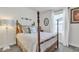 Charming bedroom with four poster bed, soft bedding, and natural light at 40511 N Birdie St, San Tan Valley, AZ 85140