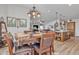 Bright dining room with an open layout and views into the living room and kitchen at 40511 N Birdie St, San Tan Valley, AZ 85140