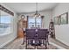 Cozy dining room featuring wood table and chairs, decorative rug, and stylish chandelier at 40511 N Birdie St, San Tan Valley, AZ 85140