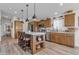 Well-appointed kitchen featuring a large island, stainless steel appliances, and ample cabinetry at 40511 N Birdie St, San Tan Valley, AZ 85140