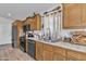 Functional kitchen features stainless steel appliances, ample counter space, and stylish decor accents at 40511 N Birdie St, San Tan Valley, AZ 85140