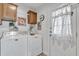 Functional laundry room with storage cabinets and modern washer and dryer at 40511 N Birdie St, San Tan Valley, AZ 85140