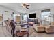 Inviting living room with a fireplace, neutral furniture, and ample natural light at 40511 N Birdie St, San Tan Valley, AZ 85140
