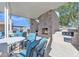 The outdoor space has comfortable seating, a fireplace, and a built-in BBQ for entertaining guests at 40511 N Birdie St, San Tan Valley, AZ 85140