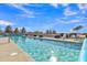 Enjoy a relaxing dip in the crystal-clear swimming pool with comfortable lounge seating around at 40511 N Birdie St, San Tan Valley, AZ 85140