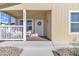 Inviting front porch with seating, complemented by charming details for a welcoming entrance at 40511 N Birdie St, San Tan Valley, AZ 85140