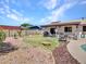 Spacious backyard with a covered patio, game area, and plenty of room to entertain at 4139 W Anderson Dr, Glendale, AZ 85308
