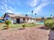 Wide backyard shot with mature landscaping, a refreshing pool, and plenty of room to play at 4139 W Anderson Dr, Glendale, AZ 85308