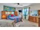 Comfortable bedroom with ceiling fan and wooden headboard at 4139 W Anderson Dr, Glendale, AZ 85308