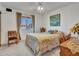 Cozy bedroom featuring natural light from the window and a comfy quilt bedding at 4139 W Anderson Dr, Glendale, AZ 85308