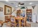 The dining room features a tile floor, ceiling fan, built in bookcase and dining table with 6 chairs at 4139 W Anderson Dr, Glendale, AZ 85308