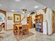 The dining room features a tile floor, ceiling fan, built in bookcase and dining table with 6 chairs at 4139 W Anderson Dr, Glendale, AZ 85308