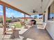 Inviting covered patio featuring seating, an outdoor kitchen area, and view of landscaped yard at 4139 W Anderson Dr, Glendale, AZ 85308