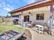 Cozy covered patio with outdoor seating, a grill, and a fire pit, perfect for outdoor gatherings at 4139 W Anderson Dr, Glendale, AZ 85308