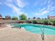 Inviting backyard pool with easy access steps and surrounding landscape at 4139 W Anderson Dr, Glendale, AZ 85308