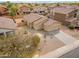 Aerial view of home with a two-car garage, low maintenance landscaping, and private backyard at 4213 E Shapinsay Dr, San Tan Valley, AZ 85140