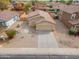Aerial view of a well-maintained home featuring desert landscaping and a spacious driveway at 4213 E Shapinsay Dr, San Tan Valley, AZ 85140