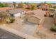 A lovely aerial view of a single-Gathering home in a quiet residential neighborhood with mature landscaping at 4213 E Shapinsay Dr, San Tan Valley, AZ 85140