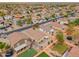 Spacious neighborhood captured from above showing houses with desert landscaping and solar panels adorning some roofs at 4213 E Shapinsay Dr, San Tan Valley, AZ 85140