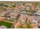 A sprawling neighborhood featuring well-kept lawns, desert landscaping and private backyard living and play spaces at 4213 E Shapinsay Dr, San Tan Valley, AZ 85140