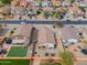 A birds-eye view showcases multiple properties with enclosed backyards and a mix of green space and desert landscaping at 4213 E Shapinsay Dr, San Tan Valley, AZ 85140
