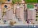 An aerial view depicts a residential neighborhood with well-maintained homes and a bird's-eye view of rooftops at 4213 E Shapinsay Dr, San Tan Valley, AZ 85140