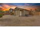 Home with a backyard featuring desert landscaping and a covered patio at dusk at 4213 E Shapinsay Dr, San Tan Valley, AZ 85140