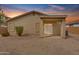 Home with a backyard featuring desert landscaping and a covered patio at dusk at 4213 E Shapinsay Dr, San Tan Valley, AZ 85140