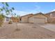 Inviting single-story home with a desert landscape, an attached two-car garage, and a classic tile roof at 4213 E Shapinsay Dr, San Tan Valley, AZ 85140