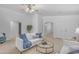 Bright living room with a ceiling fan, neutral walls, carpet flooring and modern furniture at 4213 E Shapinsay Dr, San Tan Valley, AZ 85140
