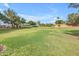 Enjoy this community park with an expansive green space, mature trees and landscaping at 4213 E Shapinsay Dr, San Tan Valley, AZ 85140