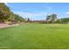 Enjoy this community green space with mature trees, landscaping and plenty of open space at 4213 E Shapinsay Dr, San Tan Valley, AZ 85140