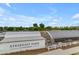 Aerial view of a serene farm with white buildings, green trees, and an overcast sky at 4247 S Zenith --, Mesa, AZ 85212
