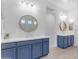 Bright bathroom with dual vanities, round mirrors, and modern fixtures at 4247 S Zenith --, Mesa, AZ 85212