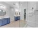 Spacious bathroom featuring dual vanities, glass shower, and tile flooring at 4247 S Zenith --, Mesa, AZ 85212