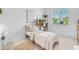 Inviting bedroom with bright window, bed with light brown and white bedding, desk, and decor for a relaxing space at 4247 S Zenith --, Mesa, AZ 85212