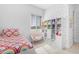 Bright bedroom with whimsical decor, a cozy chair, and ample shelving for toys and books at 4247 S Zenith --, Mesa, AZ 85212
