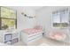 Bright bedroom with whimsical decor, a cozy chair, and ample shelving for toys and books at 4247 S Zenith --, Mesa, AZ 85212