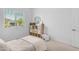Bright bedroom features a modern cabinet, window view, and comfortable bed, creating a cozy and stylish space at 4247 S Zenith --, Mesa, AZ 85212