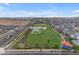 Aerial view of a sprawling community park featuring a skate park, walking trails, and manicured landscaping at 4247 S Zenith --, Mesa, AZ 85212