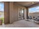 Inviting covered patio with outdoor seating and view to the backyard at 4247 S Zenith --, Mesa, AZ 85212